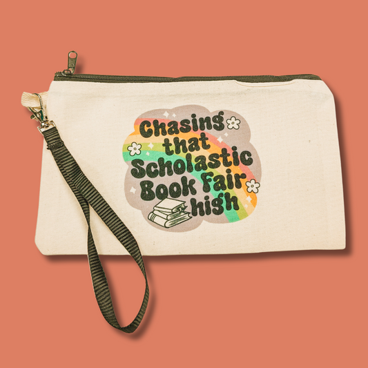 a white bag with the words chasing that scholastic book fair on it