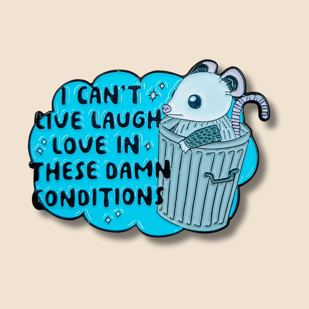 a sticker that says i can't live laugh love in these damn conditions