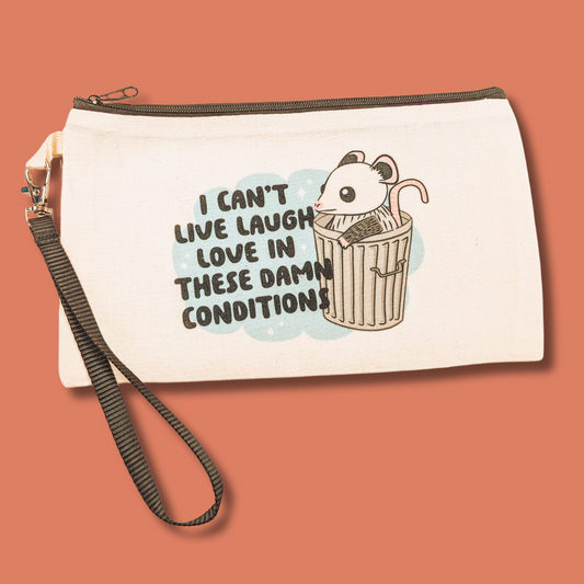 a white zippered pouch with a picture of a mouse in a trash can