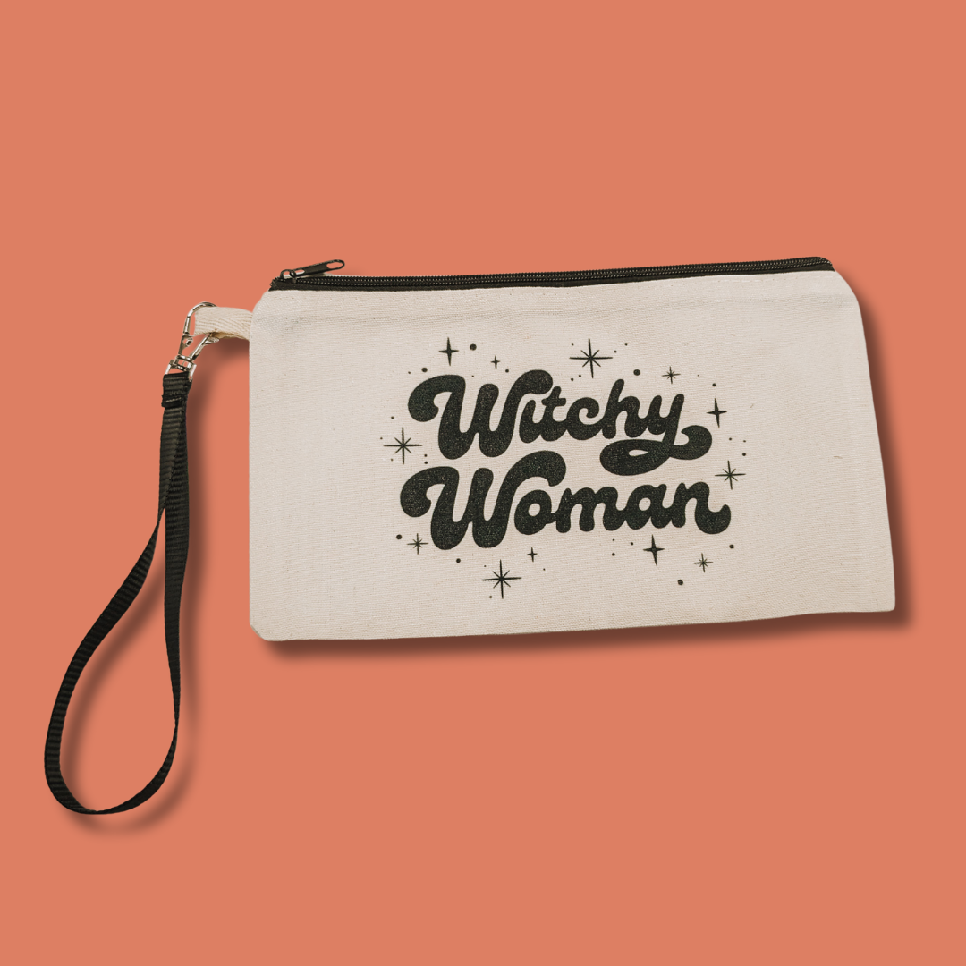 a white pouch with a black handle that says witch woman on it