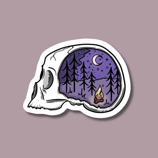 a sticker of a skull with a campfire in it