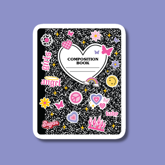 a composition book with lots of stickers on it