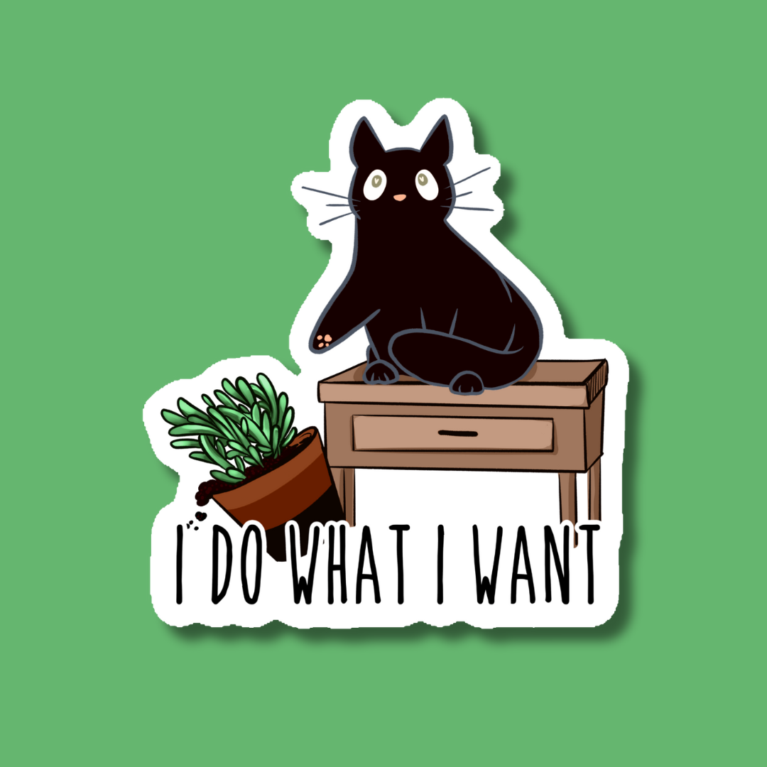 a sticker of a black cat sitting on a desk with a potted plant