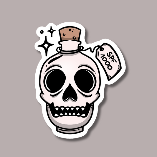 a sticker of a skull with a bottle